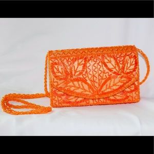 Orange beaded clutch
